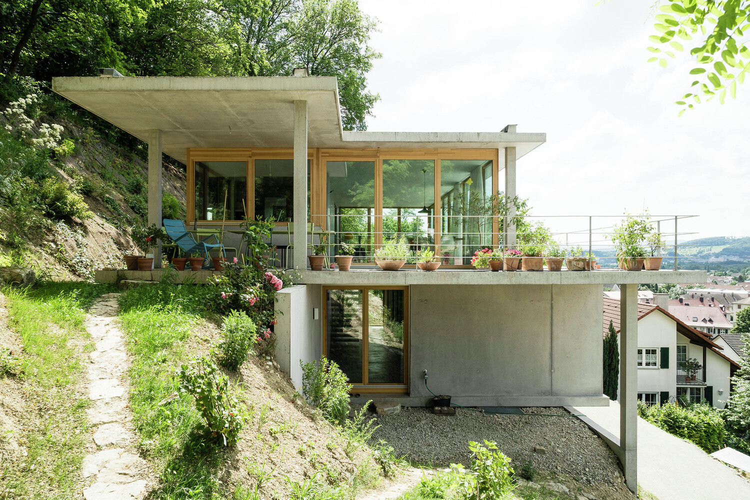 sloped to fit 14 homes that embrace the hill as a catalyst for their design - 25040